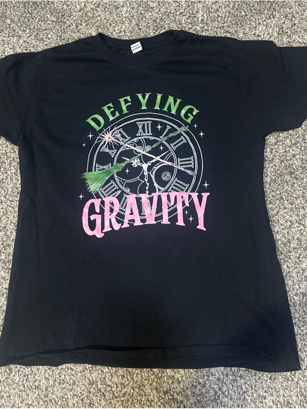 Source Unknown Black Tee with Green and Pink 'Defying Gravity' Graphic
